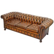 Restored vintage leather Chesterfield canapé in Thomas Chippendale style.