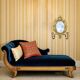 Antique bronze wall sconce with two candlesticks and beveled mirror