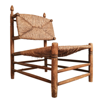 Antique oak armchair and brutalist straw