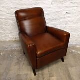 Antique club armchair from the 1950s with compass feet