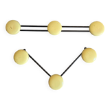 2 black and yellow metal wall coat racks