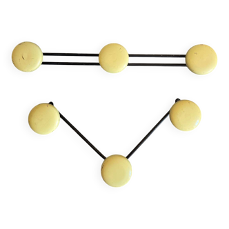 2 black and yellow metal wall coat racks