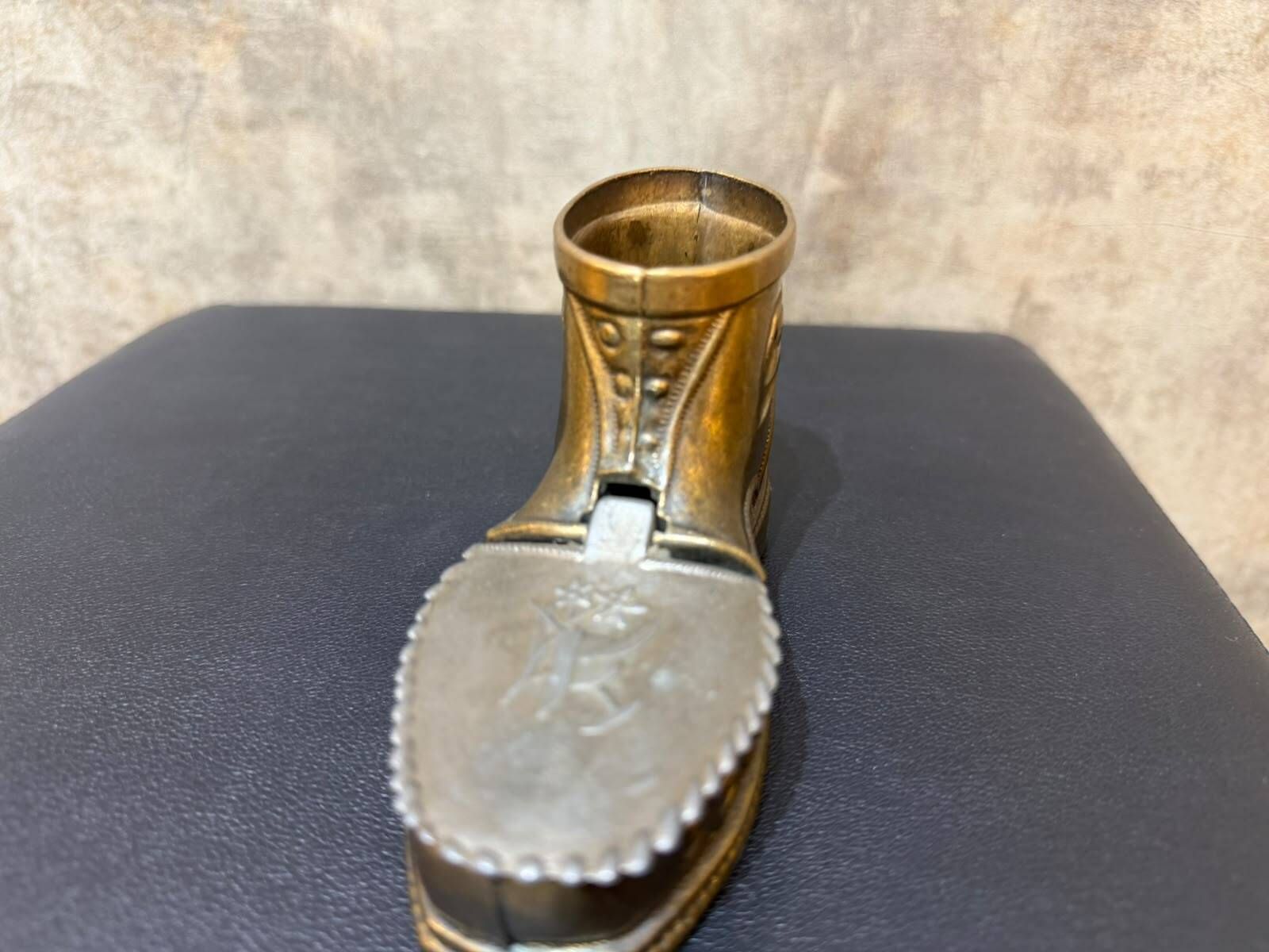 Vintage ashtray in the shape of a hiking boot with a hinged lid