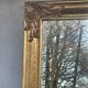 vintage bevelled mirror in rectangular shape, stucco and gilded wood in Louis XV baroque style