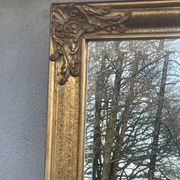 vintage bevelled mirror in rectangular shape, stucco and gilded wood in Louis XV baroque style