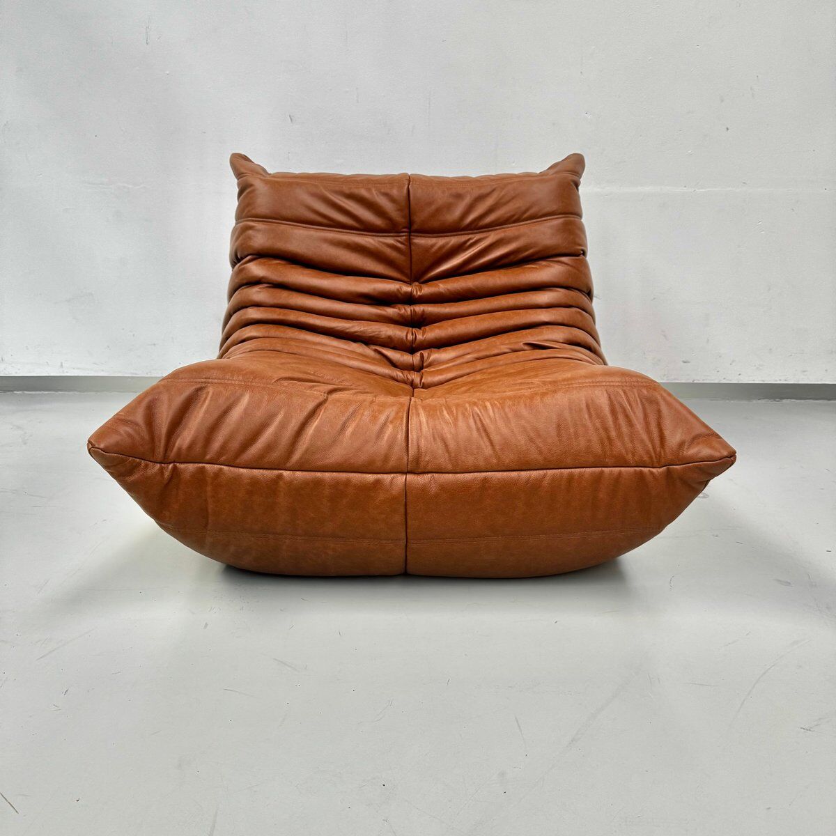 Togo Chair in Cognac Leather attributed to  Michel Ducaroy for Ligne Roset.
