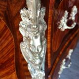 Louis XV jumping chest of drawers curved in precious wood marquetry.