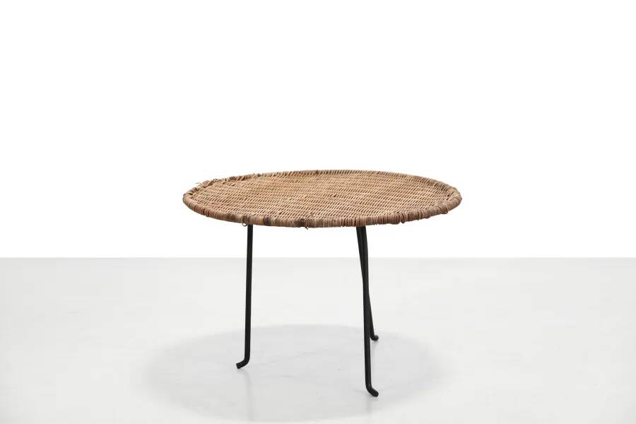 Round rattan side table by Raoul Guys