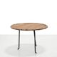 Round rattan side table by Raoul Guys