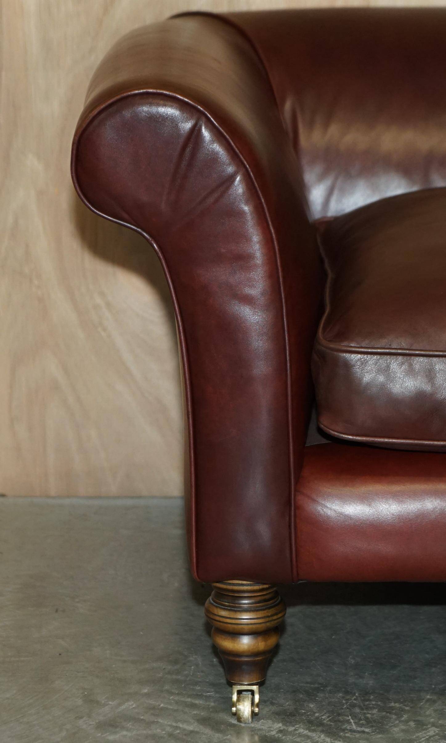 Vintage Art Deco leather sofa, three-seater, feather cushions.