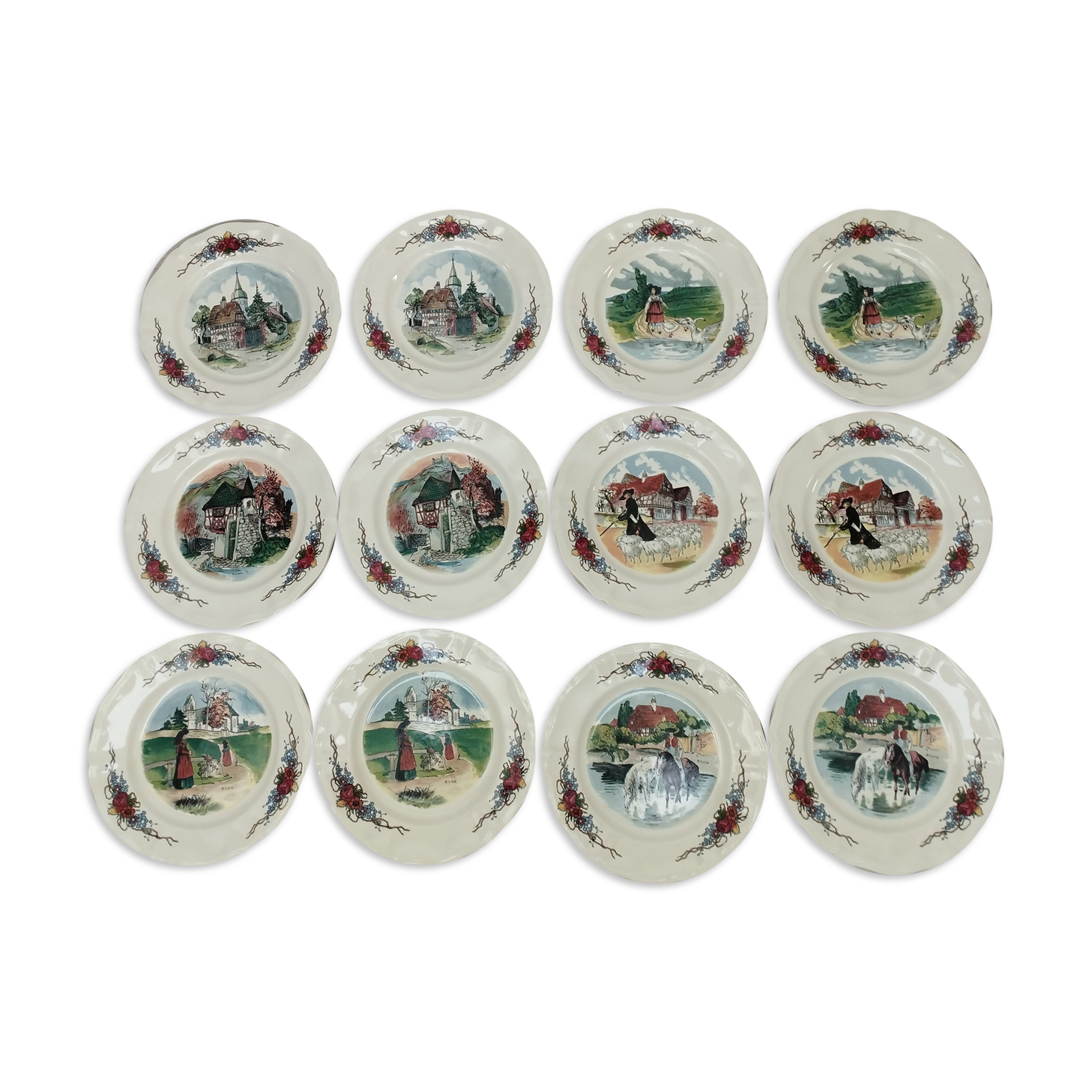 12 plates of the Obernai earthenware décor service signed Henri Loux