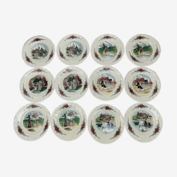 12 plates of the Obernai earthenware décor service signed Henri Loux