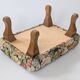 Large vintage upholstered footstool with curved legs.