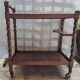 Dessert, table with wheels, side table in solid wood stained brown color France 1960