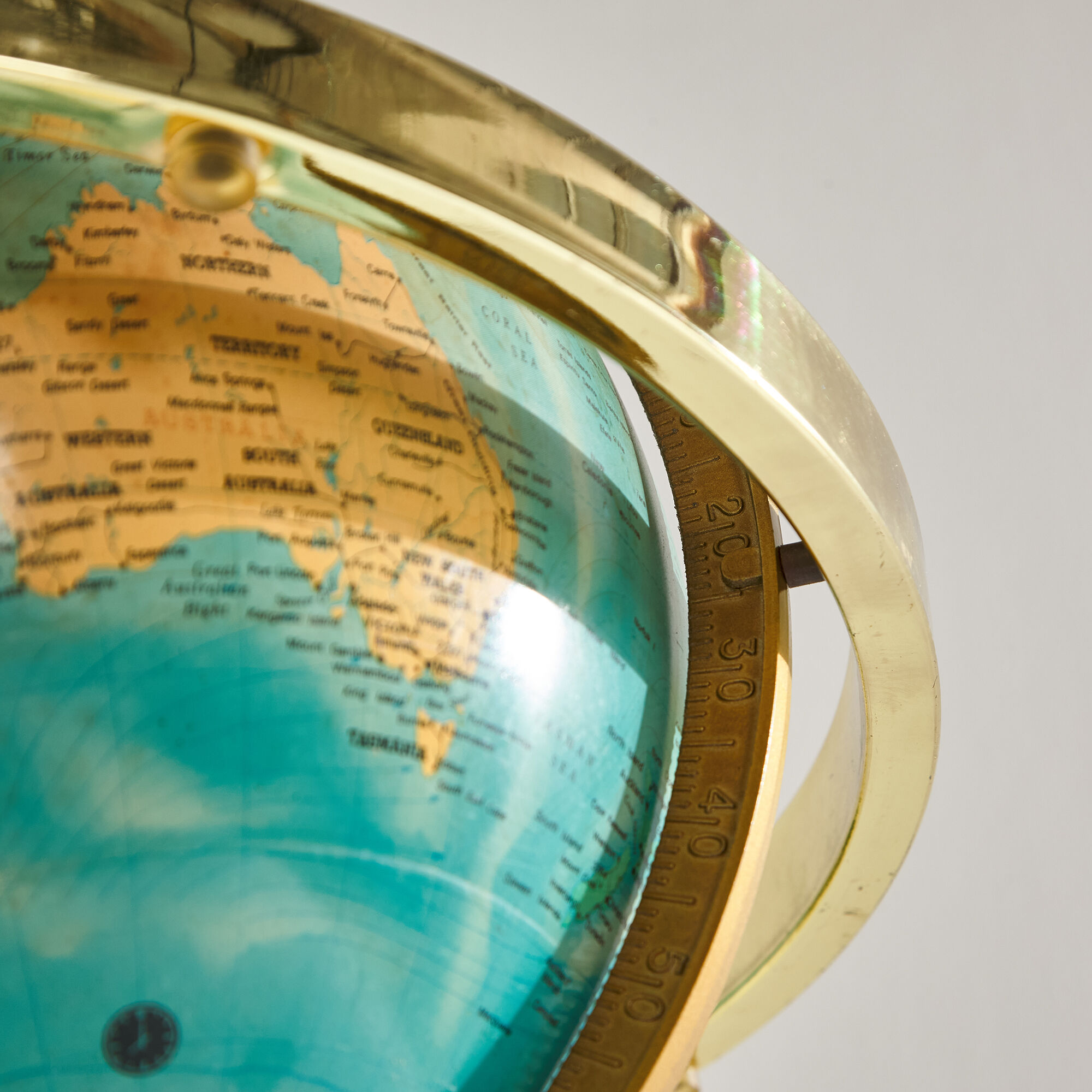 Illuminated globe on brass frame, 1980s