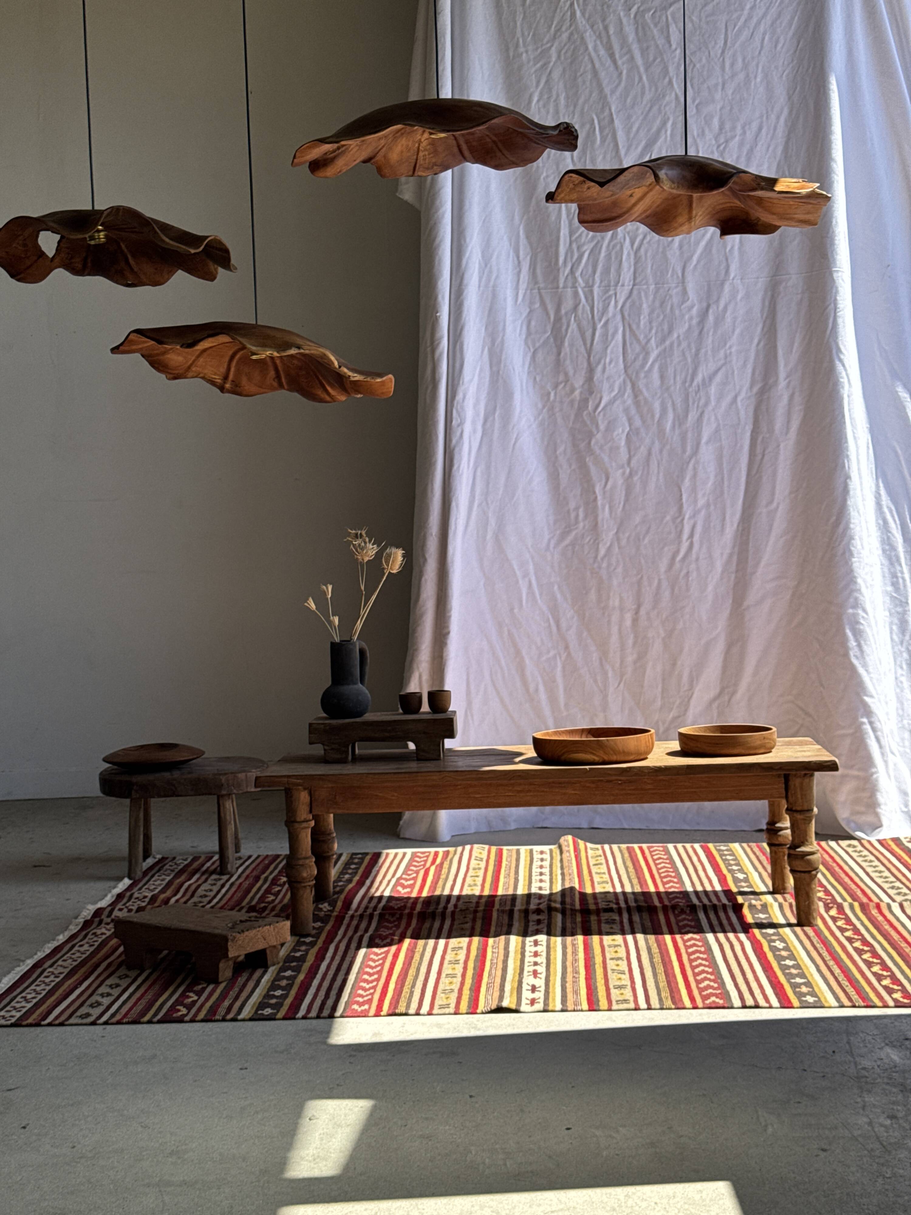 Large Indian rug with red, yellow, and white stripes and geometric fringes.