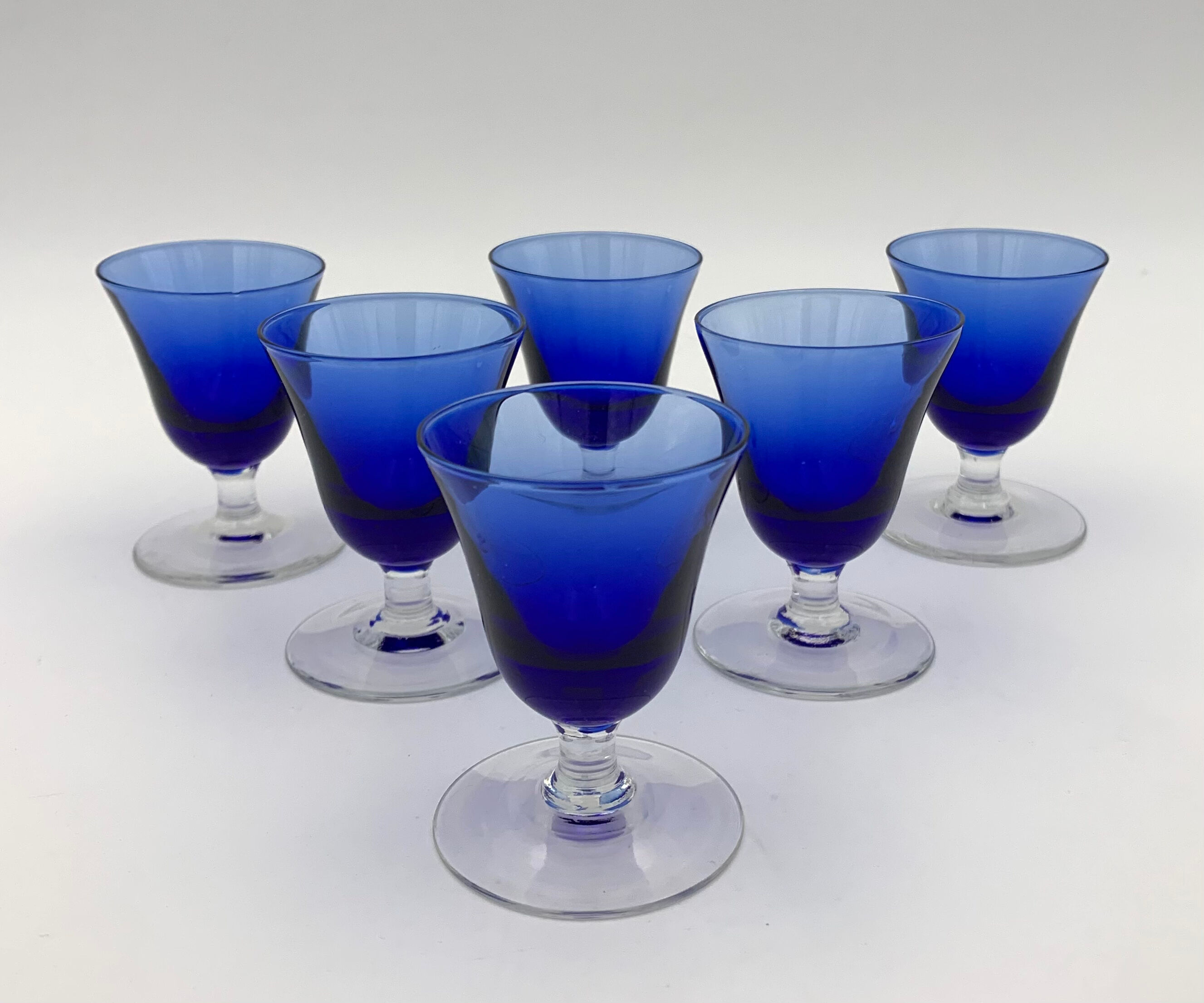Nine vintage liquor glasses, coloured glass 20th century