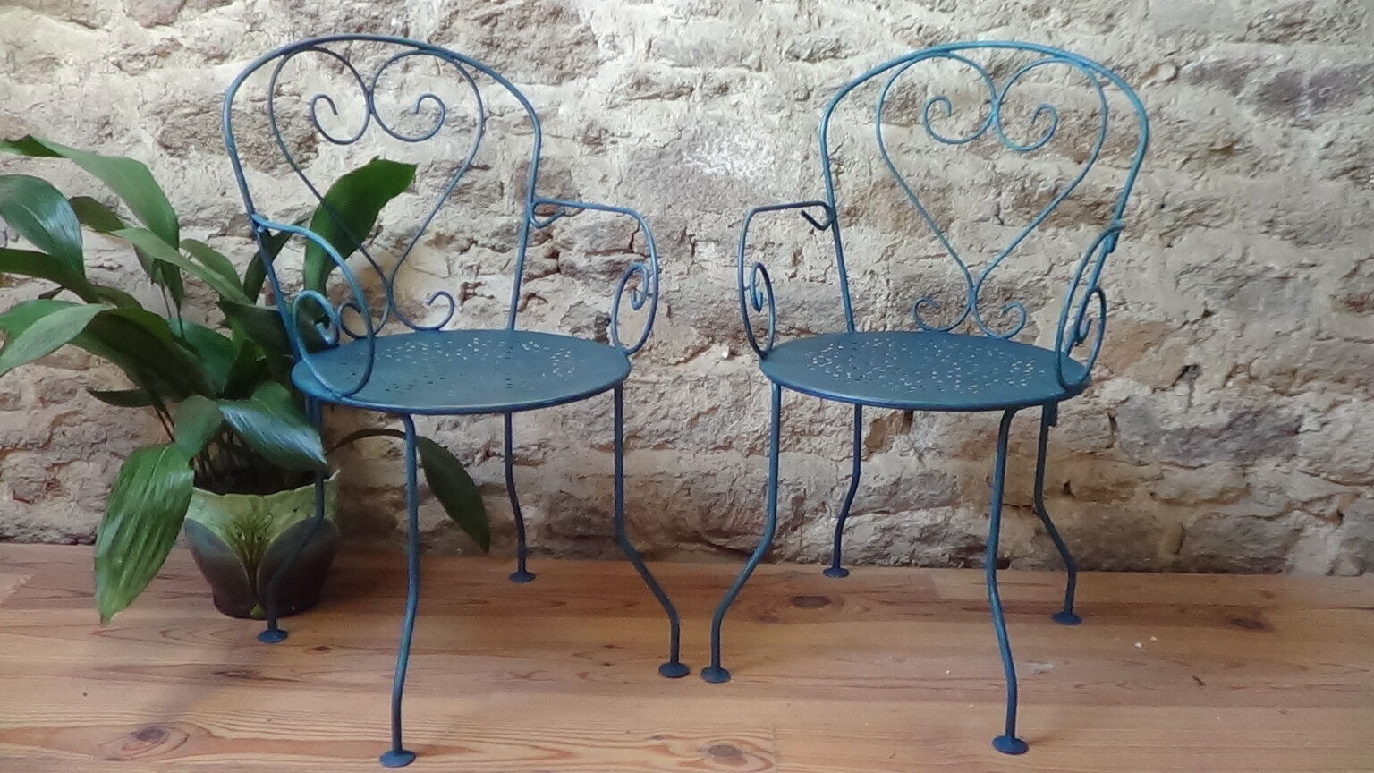 A pair of metal garden chairs