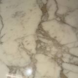 Tulip dining table in marble by Eero Saarinen for Knoll International.