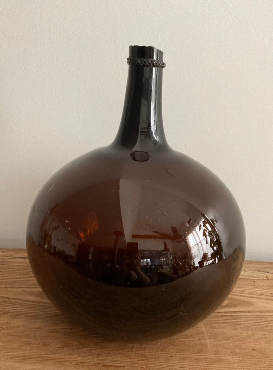 Old amber demijohn