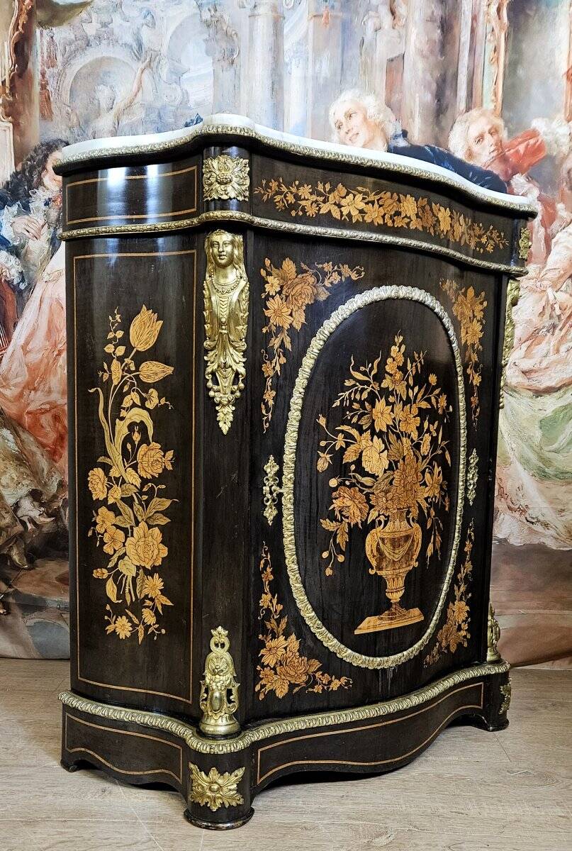 Boulle furniture with a curved shape from the Napoleonic III era in lacquered wood and marquetry.