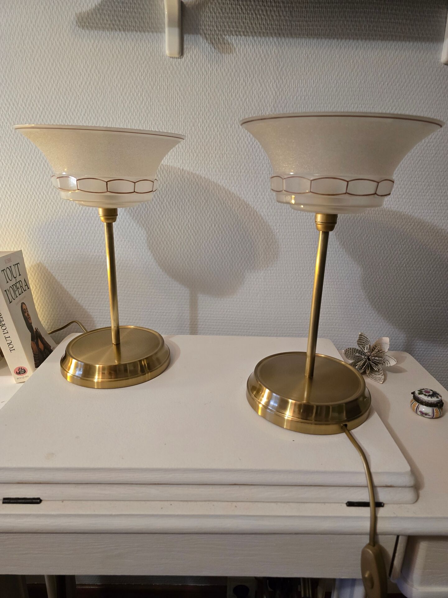 Art Deco table lamps with frosted glass shade and brass base.
