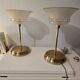 Art Deco table lamps with frosted glass shade and brass base.