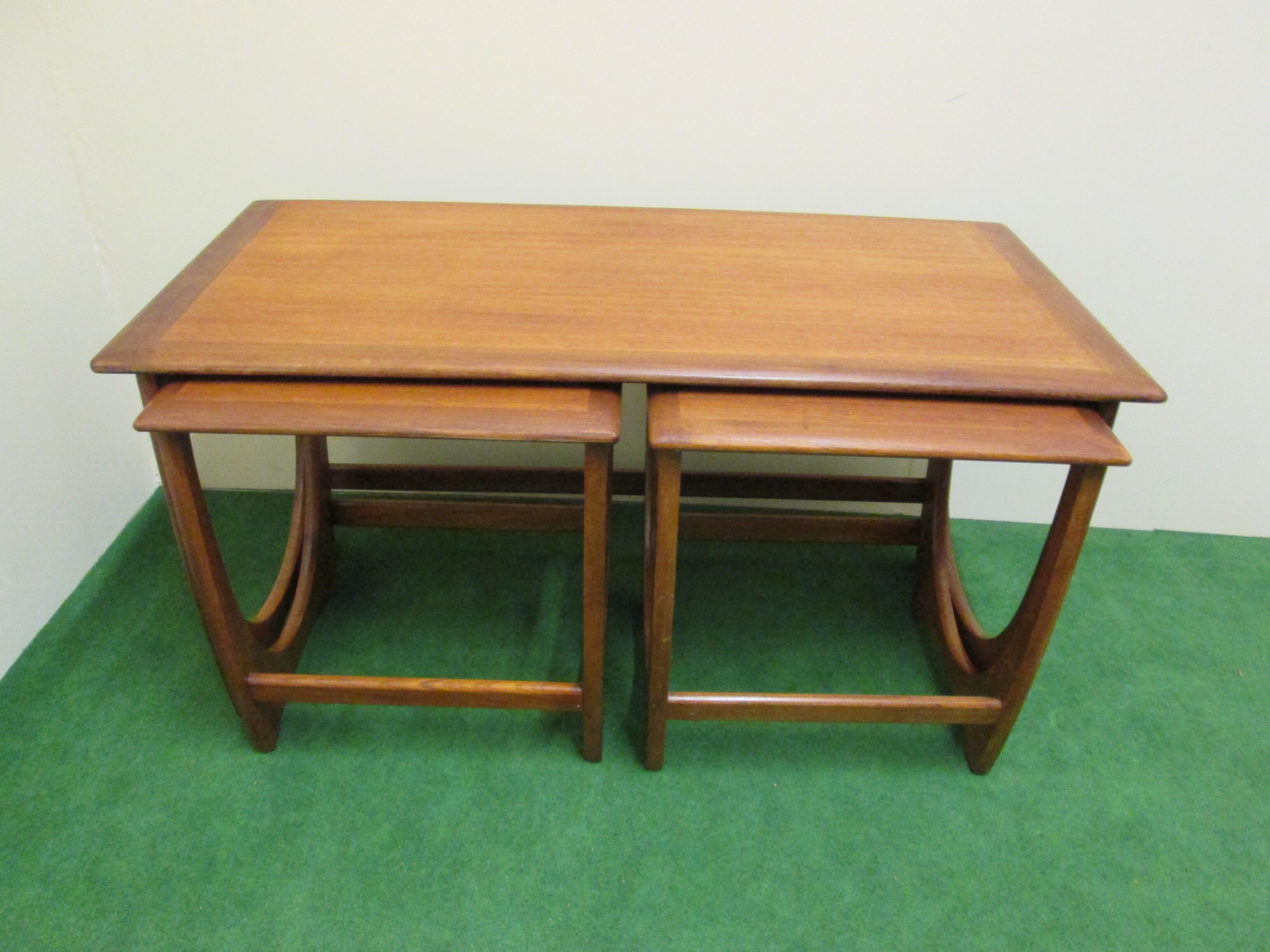 Nesting coffee tables in teak