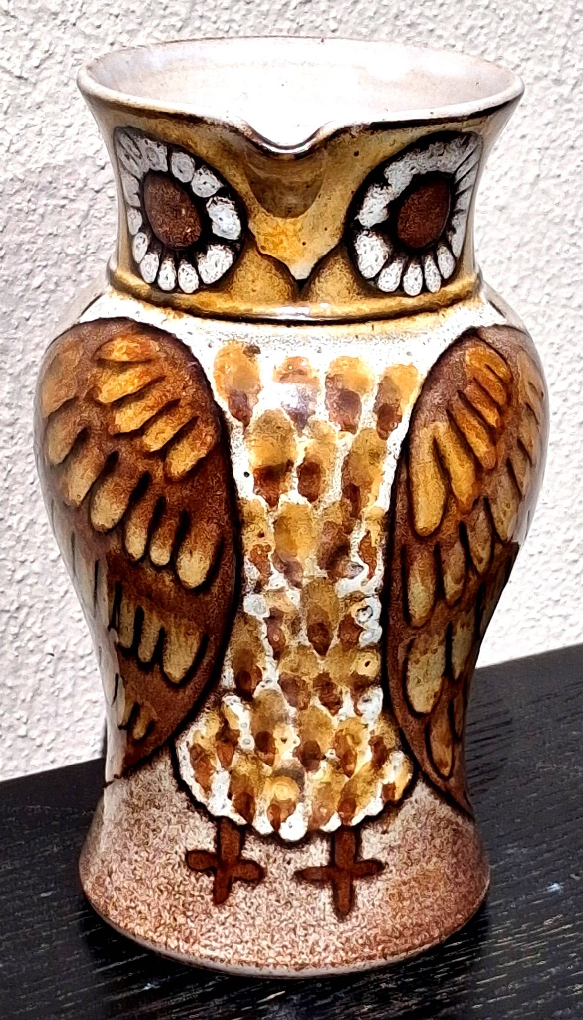 Stoneware water jug, owl decoration, signature to be identified.