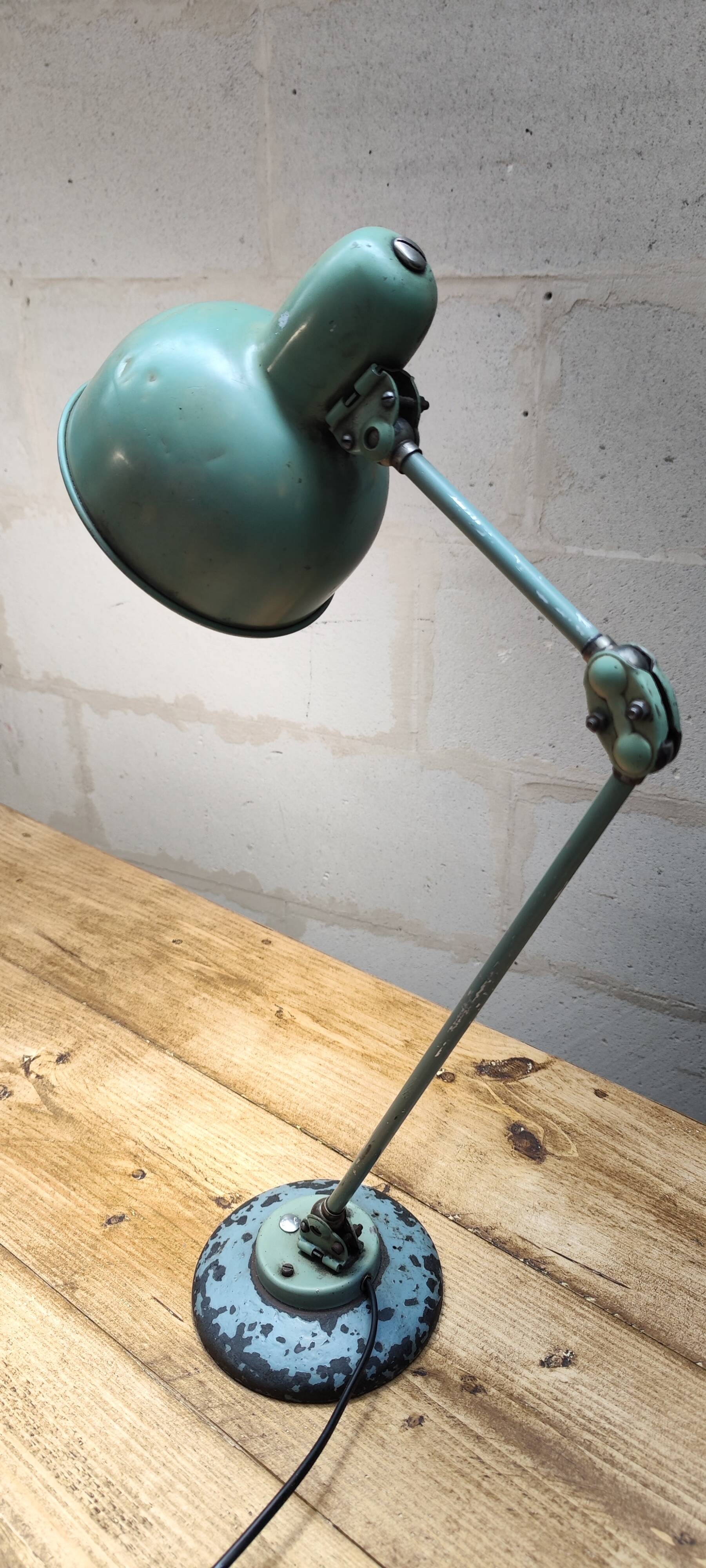 Old green industrial desk lamp