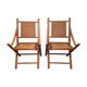 Pair of folding chairs in bamboo and caning, leather and brass
