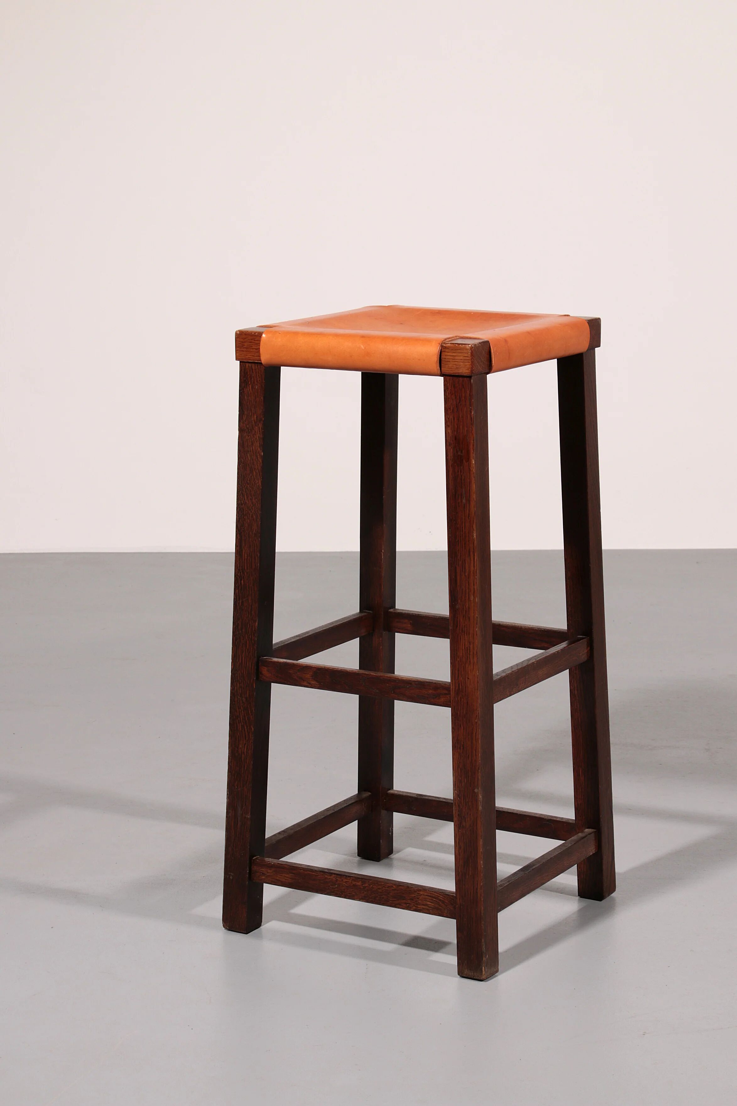 Mid-century oak bar stools with cognac leather seats