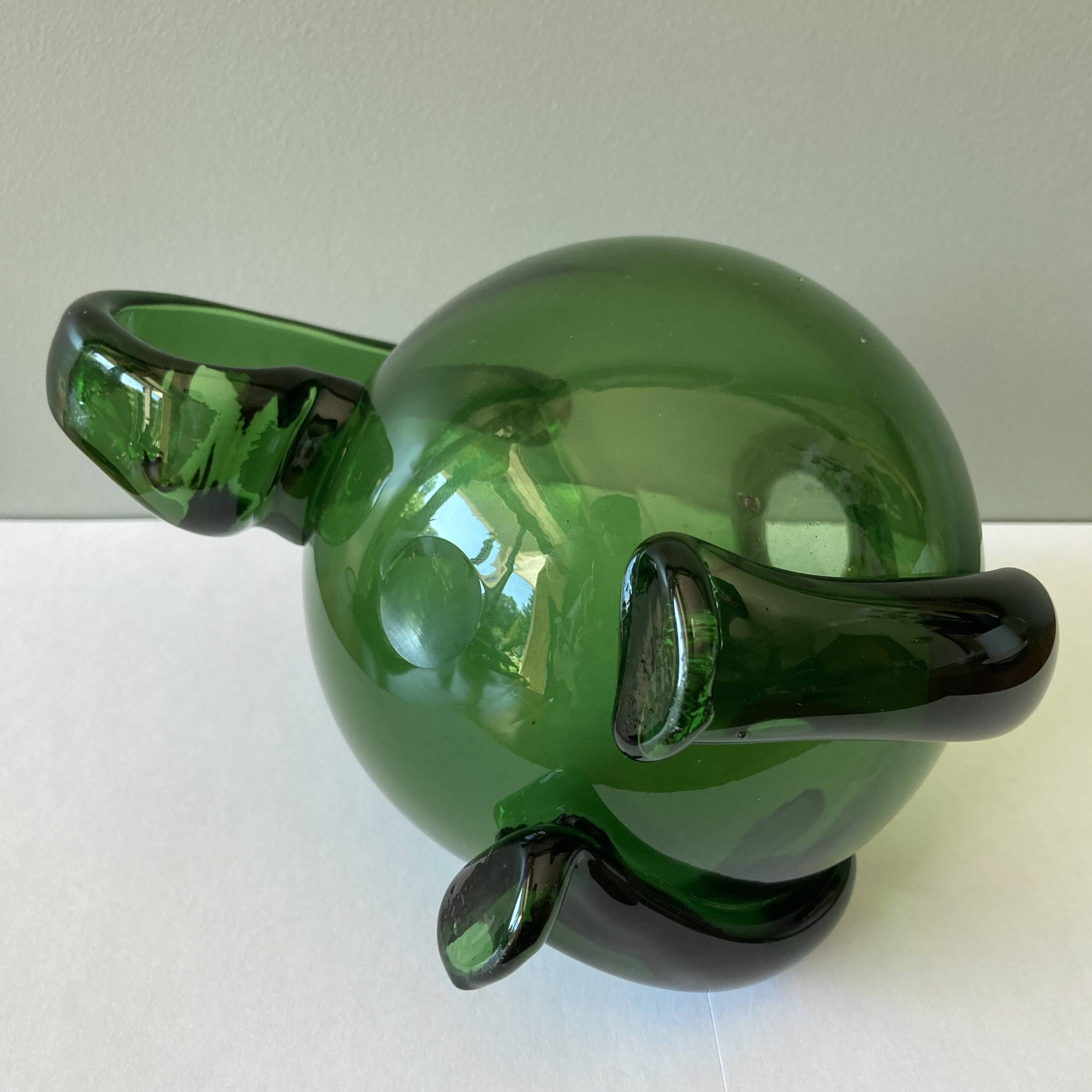 Amazing pitcher; vintage tripod jug or carafe in blown and hot-worked green glass