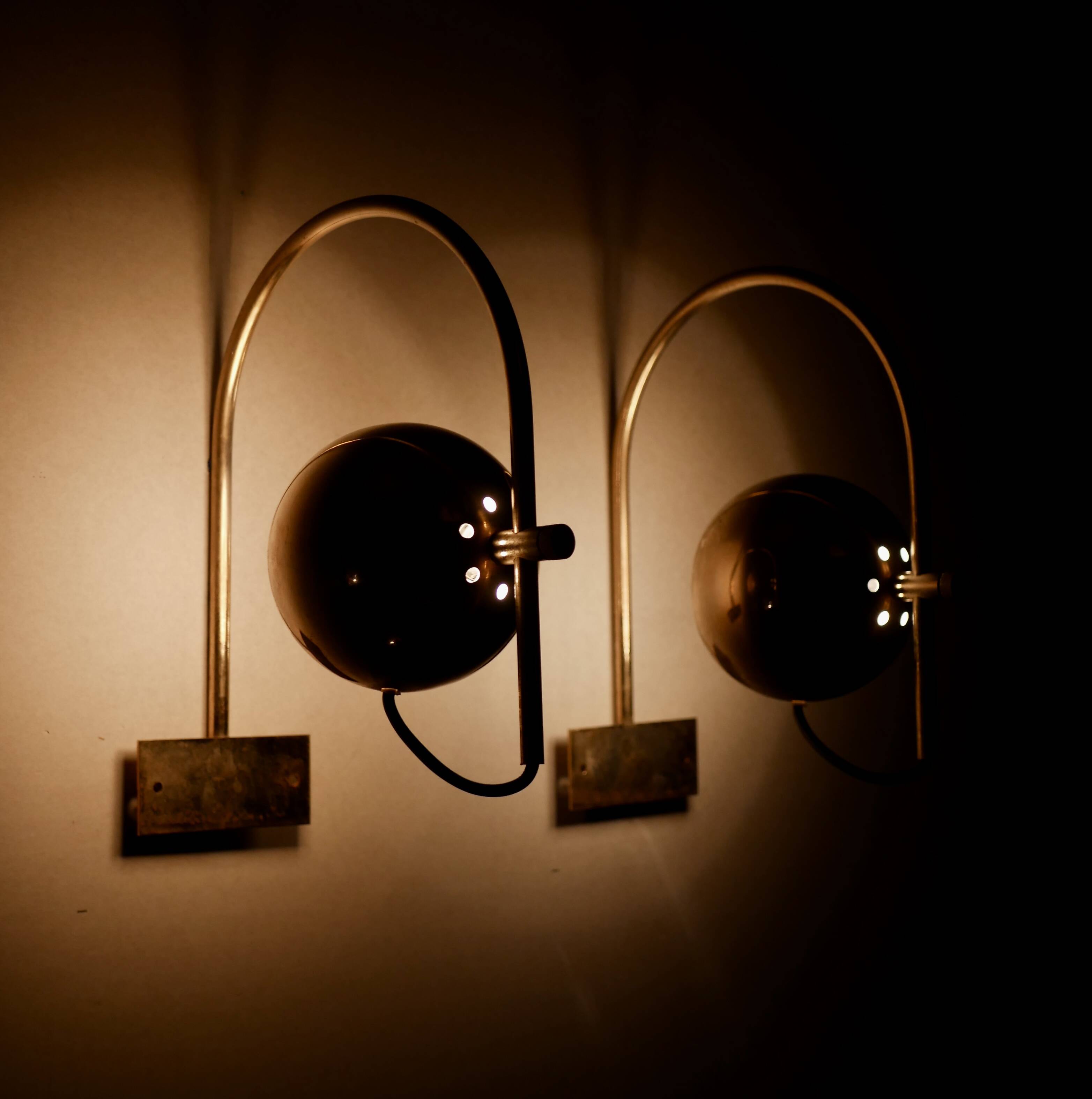 Pair of brass eyeball wall lights