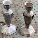 Pair of metal candlesticks, chiseled with a statuette in front, rose pattern in relief, art deco