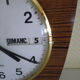 Formica wall clock with day and date - 1970s