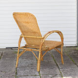 Rattan armchair with reclining backrest