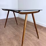 Coffee table in wood and smoked glass