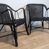 Paire de fauteuils noirs en rotin