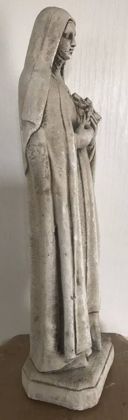 Religious statue of sainte therese of lisieux “the little flower of jesus” in stone