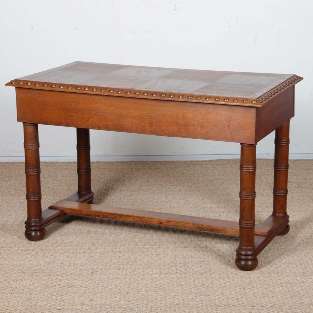 Oak and brass desk in the style of Charles Dudouyt, 1940.
