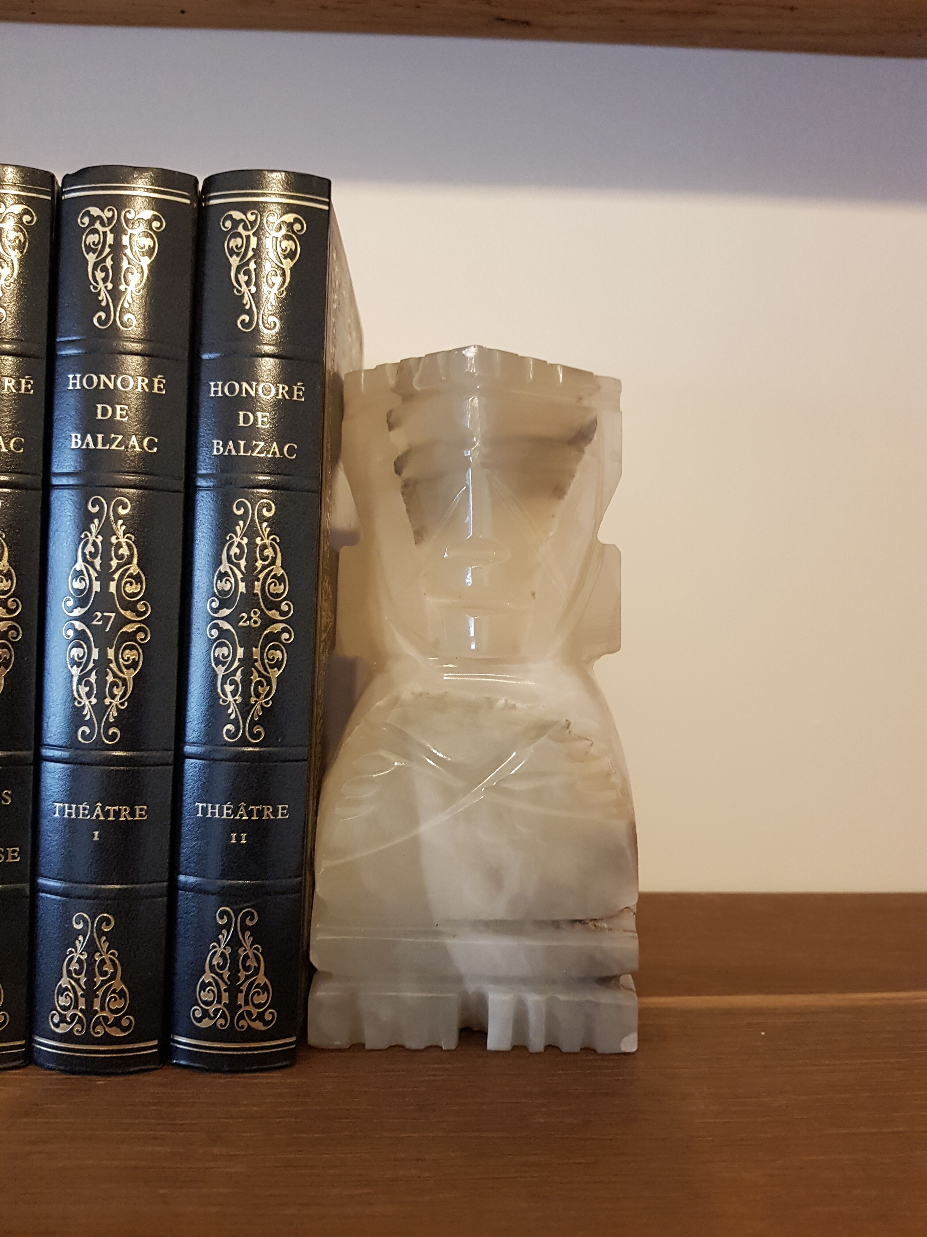 Onyx book clambands depicting an Aztec statue