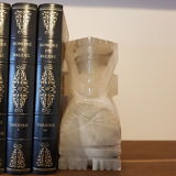 Onyx book clambands depicting an Aztec statue
