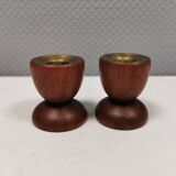 Two beautiful teak candle holders with brass inserts.
