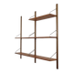 Danish wall shelving system in teak from the 1960s.