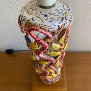 Openwork ceramic lamp base with Garden of Eden decor