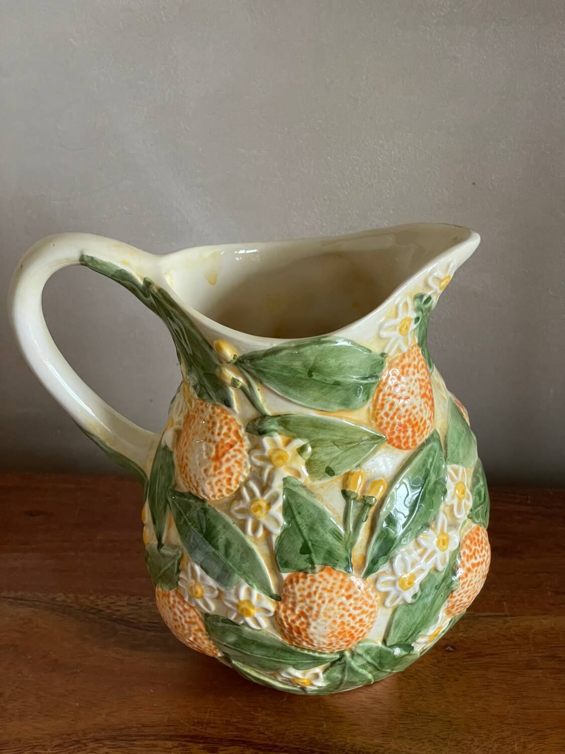 Orange slipware pitcher