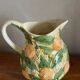 Orange slipware pitcher