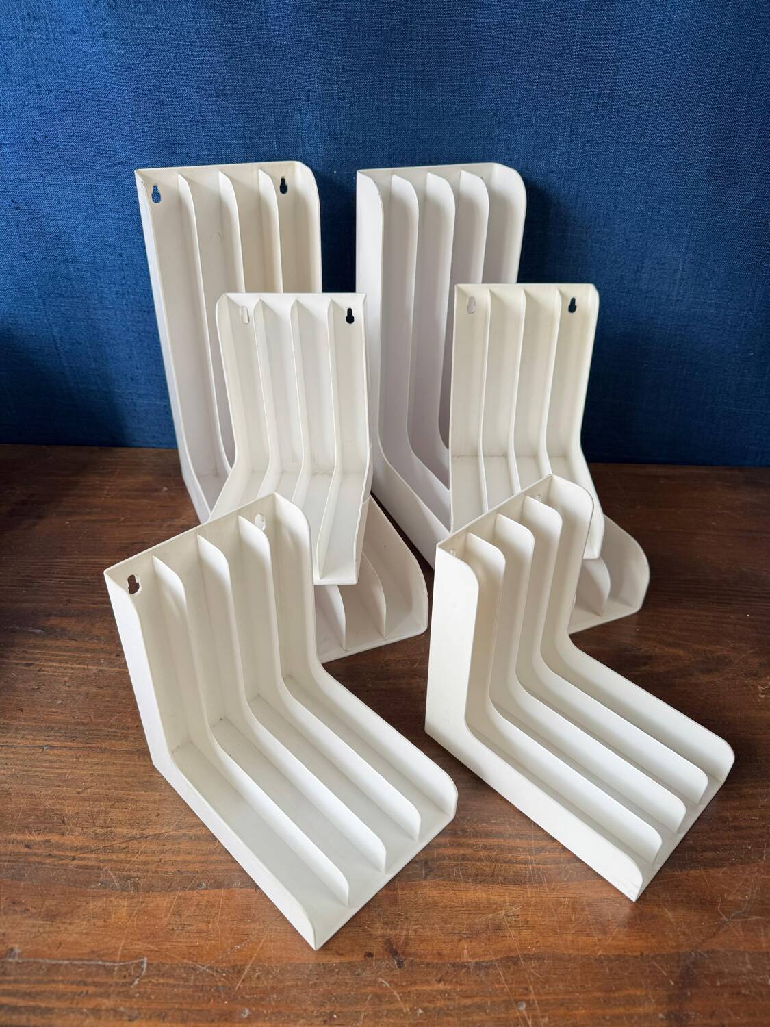 Set of 6 boomerang-shaped vinyl record racks/storage units. 1970s/80s.