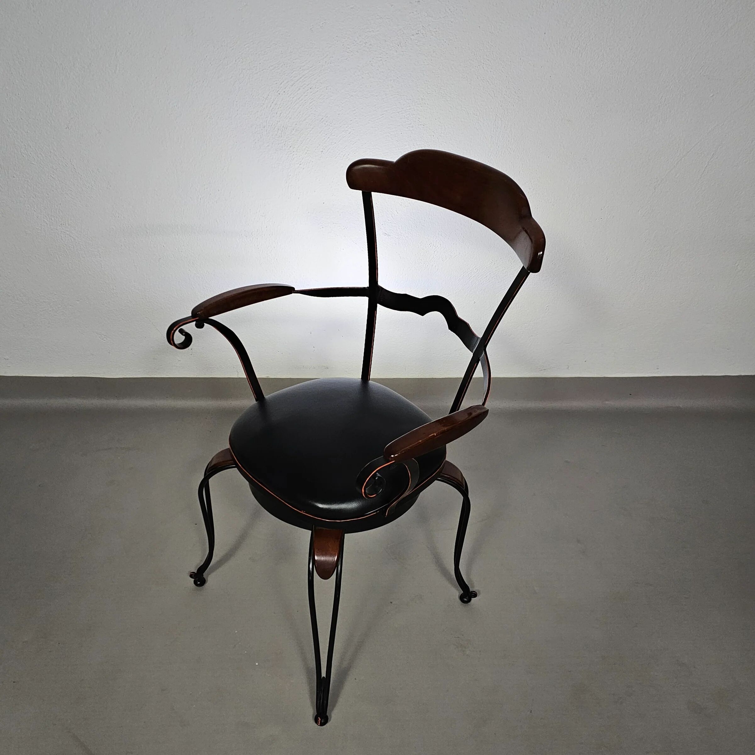 Italian postmodern turnable wrought iron dining chairs with leather seats